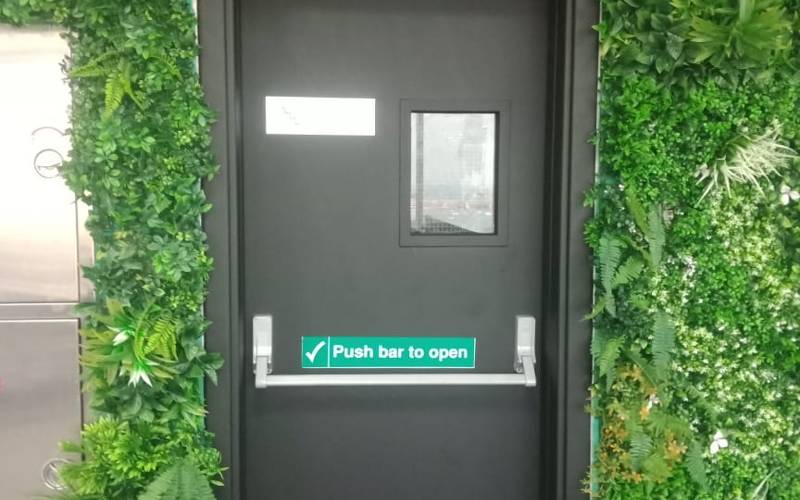Interior door wrapped in a matte dark finish