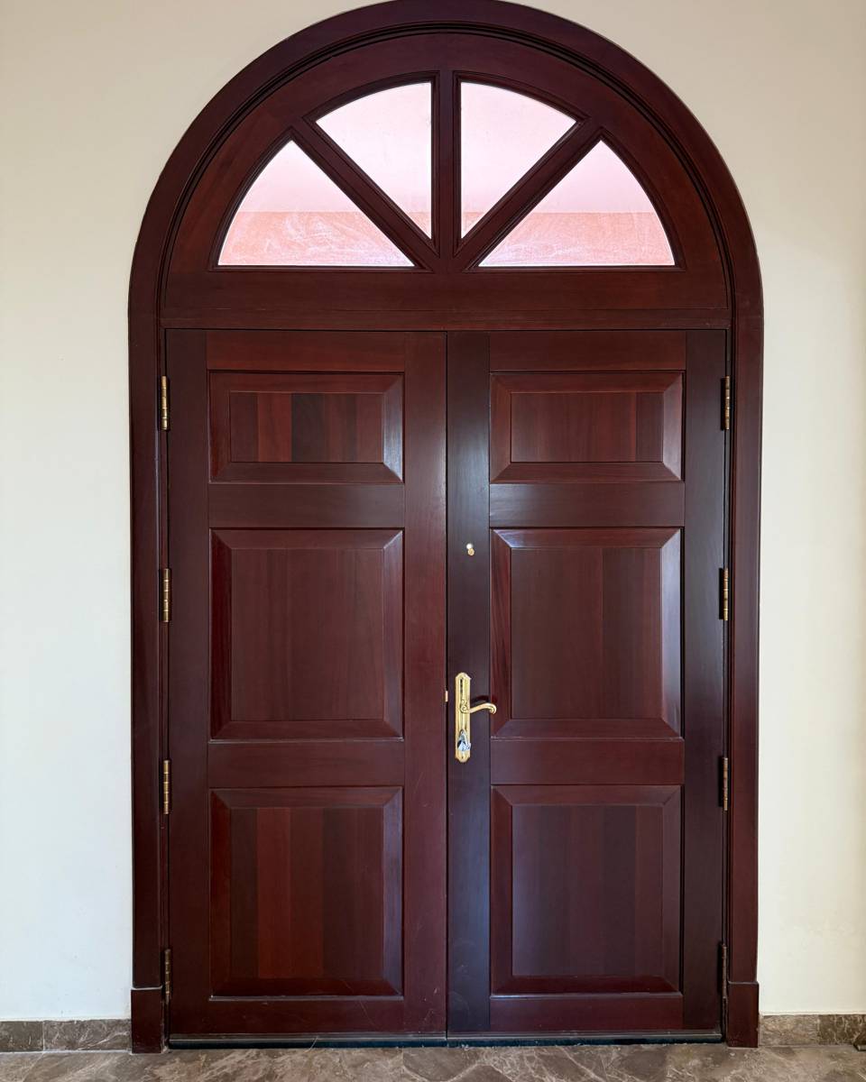 Close-up of a wood-effect vinyl wrap applied to a door panel