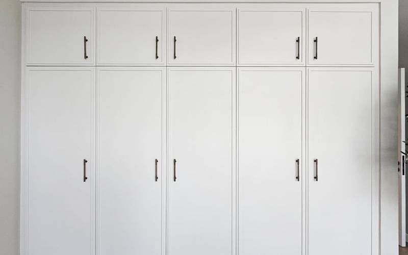 Built-in wardrobe wrapped in a bright white finish